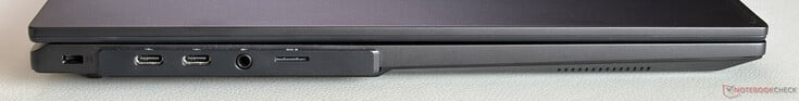 À esquerda: Trava Kensington, 2 portas USB-C 4.0 com Thunderbolt 4 (40 Gbps, DisplayPort 2.1, Power Delivery), conector estéreo de 3,5 mm, leitor de cartão microSD
