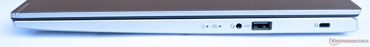 Direita: conector de áudio combinado, 1x USB 2.0 Tipo A, fechadura Kensington