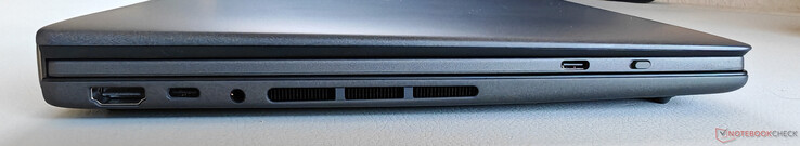 Esquerda: HDMI 2.1 FRL, USB-C 4.0 com Thunderbolt 4 (40 GBit/s, DisplayPort, Power Delivery), áudio de 3,5 mm, USB-C no teclado (somente para carregamento)