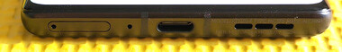 Parte inferior: Bandeja do SIM, microfone, porta USB-C, alto-falantes