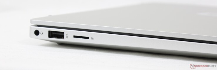 Esquerda: Fone de ouvido 3,5 mm, USB-A 5 Gbps, leitor MicroSD