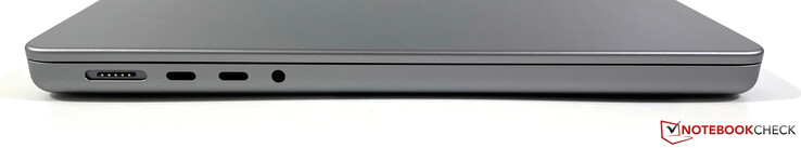 Esquerda: MagSafe, 2x USB-C 4.0 com Thunderbolt 4 (40 Gbps, DisplayPort modo ALT 1.4, Power Delivery), áudio 3.5 mm
