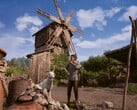 Uma imagem que mostra um agricultor e um moinho no jogo Medieval Dynasty.