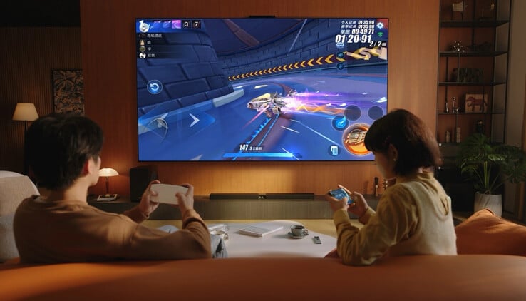 O Huawei Mate TV Pro transmitindo jogos sem fio a partir de um smartphone e sendo controlado por seu incomum controle remoto trackpad. (Fonte da imagem: Huawei)