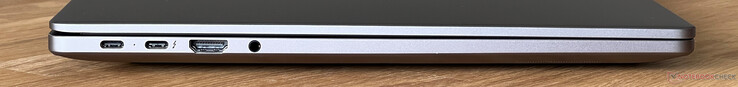 Lado esquerdo: USB-C 3.2 Gen.1 (5 Gb/s, modo DisplayPort alt, Power Delivery), USB-C 4.0 com Thunderbolt 4 (40 Gb/s, modo DisplayPort alt, Power Delivery), HDMI 2.1, áudio de 3,5 mm