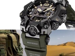 Close-up do Casio G-Shock Mudmaster GWG-B1000-1A3, mostrando sua caixa preta, detalhes em bege no mostrador, pulseira verde-oliva, proteções robustas e a inscrição “Triple Sensor”, tendo como pano de fundo equipamentos militares e uma paisagem desértica.