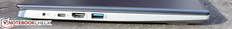 Esquerda: adaptador AC (plugue de barril), USB Tipo C 3.1 c/ PD e DisplayPort, HDMI, USB-A 3.1