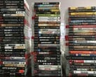 Uma coleção de jogos físicos de PS3 na foto