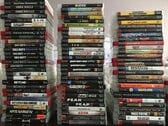 Uma coleção de jogos físicos de PS3 na foto
