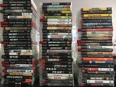 Uma coleção de jogos físicos de PS3 na foto