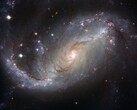 Uma imagem mostrando a galáxia NGC 1672 e as estrelas do universo. (Fonte da imagem: WikiImages - Pixabay)