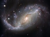 Uma imagem mostrando a galáxia NGC 1672 e as estrelas do universo. (Fonte da imagem: WikiImages - Pixabay)