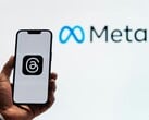 Meta, logo of which is pictured in the background, has started an acquisition spree of AI startups. (Image Source: Julio Lopez - Pexels)