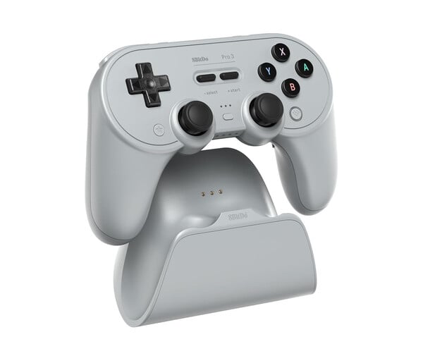 O 8BitDo Pro 3 vem com uma base de carregamento que abriga o adaptador de 2,4 GHz. (Fonte da imagem: 8BitDo)