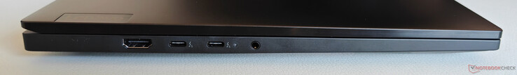 Esquerda: HDMI 2.1, 2x USB-C 4.0 com Thunderbolt 5 (80 Gbit/s, DisplayPort 2.1, Power Delivery 3.1), áudio de 3,5 mm