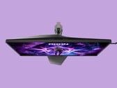 A imagem mostra o monitor para jogos AOC AG276UZ contra um fundo roxo. O monitor para jogos apresenta um design bem voltado para jogos, com iluminação RGB na parte traseira.