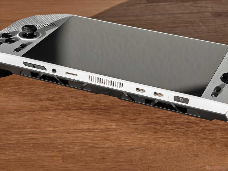 Portas: Botões de volume, áudio de 3,5 mm, leitor de cartão microSD, 2x USB-C 4.0 com Thunderbolt 4 (40 Gbit/s, modo DisplayPort ALT, Power Delivery 3.0), botão liga/desliga com leitor de impressões digitais