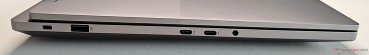 Esquerda: Trava Kensington, USB-A 3.2 Gen.2 (10 Gbit/s, sempre ligado), 2x USB-C 4.0 com Thunderbolt 4 (40 Gbit/s, DisplayPort 2.1, PowerDelivery 3.0), áudio de 3,5 mm