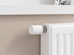 Aqara Radiator Thermostat W600 instalado em um radiador branco (Fonte da imagem: Aqara)