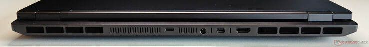 Traseira: USB-C 4.0 com Thunderbolt 4 (40 Gbps, DisplayPort 2.1 via iGPU, fornecimento de energia de 140 W), conector de alimentação, Mini DisplayPort 2.1 (via dGPU, DP40/UHBR10, VRR/G-Sync), HDMI 2.1 (via dGPU, 48 Gbps, HDCP 2.3, VRR/G-Sync)
