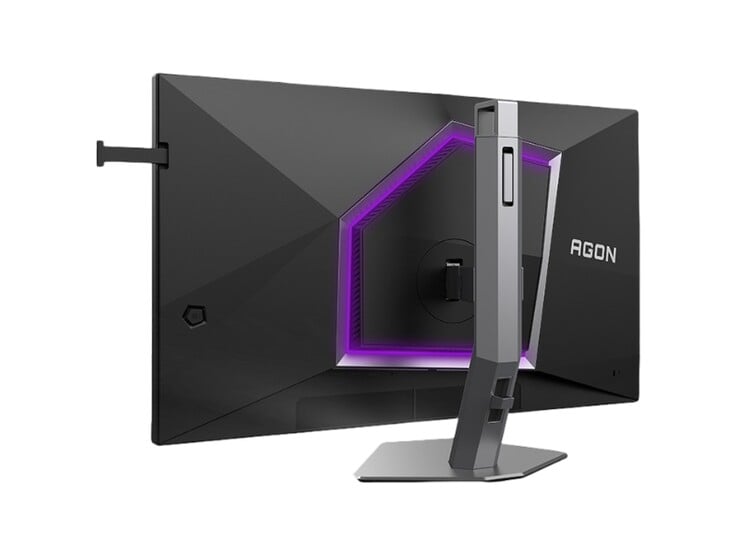 A imagem mostra a parte traseira do monitor para jogos AOC Agon Pro AG276UZ, que apresenta um design bastante voltado para jogos com RGB roxo.