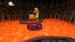 Croc Legend of the Gobbos captura de tela mostrando Croc pulando sobre a lava
