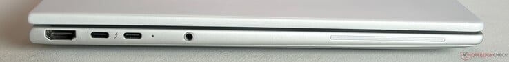 À esquerda: HDMI 2.1, 2 portas USB-C 4.0 com Thunderbolt 4 (40 Gbps, DisplayPort 2.1, fornecimento de energia), conector estéreo de 3,5 mm