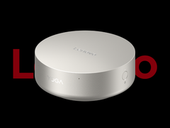 O mini PC Lenovo Yoga Mini i, retratado em um fundo preto com o logotipo da Lenovo na parte superior. (Fonte da imagem: Lenovo - editado)