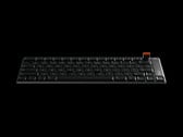 O teclado é usinado por CNC a partir de um único bloco de alumínio e inclui um seletor giratório magnético removível para controle de volume e mídia.