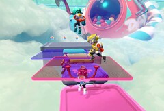 Captura de tela do Popucom com personagens em plataformas nas nuvens resolvendo quebra-cabeças
