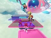 Captura de tela do Popucom com personagens em plataformas nas nuvens resolvendo quebra-cabeças