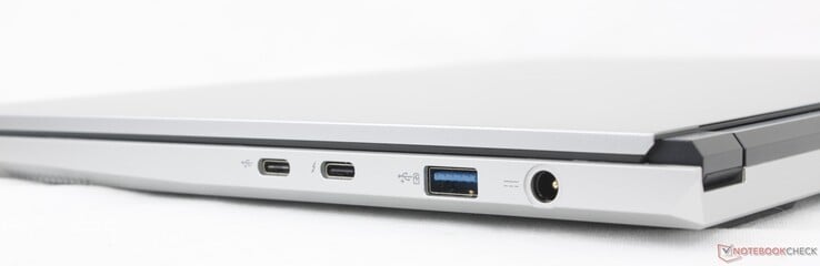 Direito: USB-C 3.2 Gen. 2 com fornecimento de energia, USB-C Thunderbolt 4 com DisplayPort 2.1 + fornecimento de energia, USB-A 3.2 Gen. 2, adaptador CA