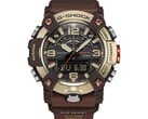 Close-up do G-Shock Mudmaster GG-B100XMH-5A, destacando sua caixa e luneta nas cores amarelo-ouro claro e marrom.