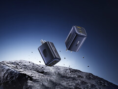 O novo PicoGo 67 W AE11 custa US$ 39,99. Na foto: Uma imagem promocional do carregador rápido flutuando no ar sobre rochas. (Fonte da imagem: Baseus)