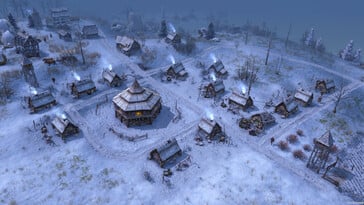Uma imagem que mostra uma vila coberta de neve em Farthest Frontier.