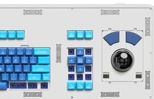 O painel superior é fixado magneticamente, e o circuito do trackball se encaixa para substituir o teclado numérico (Fonte da imagem: Atomic)