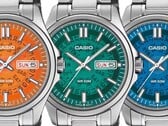 Três relógios Casio MTP-E740 nas cores laranja, azul-petróleo e azul brilhante, exibidos lado a lado com mostradores translúcidos que revelam os mecanismos de dia e data por baixo.