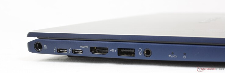 Esquerda: Porta adaptador AC, 2x USB-C c/ Thunderbolt 4 + DisplayPort + Power Delivery, HDMI 2.0, USB-A 3.2, fone de ouvido 3.5 mm
