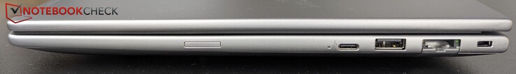 À direita: Slot SIM opcional, USB-C (20 Gb/s), USB-A (5 Gb/s), LAN (1 Gb/s), Kensington