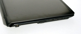 Right side: USB 2.0 port, DVD optical drive, LAN port, VGA interface, Kensington lock