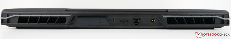 Voltar: Slot para XMG OASIS (com tampa), USB-C 3.2 Gen 2×1 (DisplayPort 1.4a), HDMI 2.1 (compatível com G-SYNC, HDCP 2.3), porta RJ45 2.5 Gb/s (LAN), adaptador AC