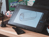 Huion Kamvas 16 Gen 3 sobre a mesa com luva de desenho stylus e teclado