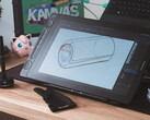 Huion Kamvas 16 Gen 3 sobre a mesa com luva de desenho stylus e teclado