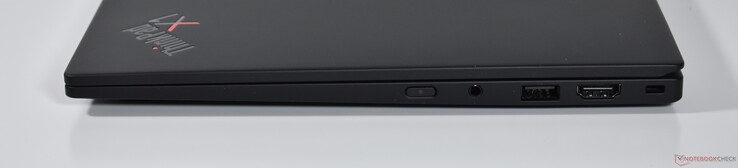 direita: áudio de 3,5 mm, USB-A 3.2 Gen 1, HDMI, trava Kensington