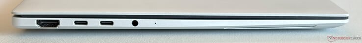 À esquerda: HDMI 2.1 TDMS, 2 portas USB-C 4.0 com Thunderbolt 4 (40 Gbit/s, modo ALT do DisplayPort, Power Delivery)