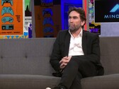Uma captura de tela de Leslie Benzies durante uma entrevista com a IGN