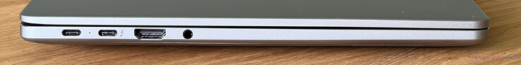 Esquerda: USB-C 3.2 Gen 1 (5 Gbit/s, modo DisplayPort ALT, Power Delivery), USB-C 4.0 com Thunderbolt 4 (40 Gbit/s, modo DisplayPort ALT, Power Delivery), HDMI 2.0, áudio de 3,5 mm
