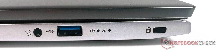 Direita: 1x conector 3,5mm, 1x USB tipo A 3,1 gen. 1, 1x Kensington