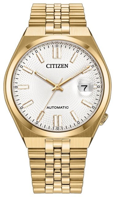 Relógio automático Citizen Tsuyosa 60 com caixa em aço inoxidável com acabamento dourado e pulseira estilo Jubilee, mostrador branco com padrão guilloché e lupa ciclópica para a data.