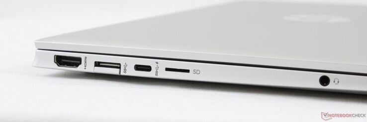 Esquerda: HDMI 2.0, USB-A 5 Gbps, USB-C 10 Gbps c/ PD e DisplayPort 1.4, leitor MicroSD, áudio combinado de 3,5 mm